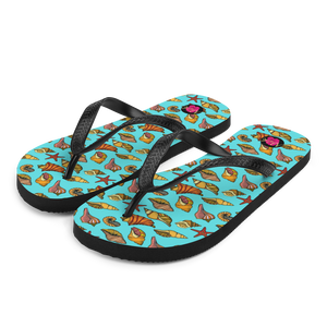 "Chancletas" (Flip Flops) con representación artística de los caracoles en la arena de Puerto Rico.